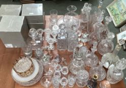 A collection of glassware to include a Moser style decanter and four glasses, decanters, vases and