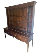 A Georgian oak dresser, 200cmH x178cmW, with splits and in need of some attention, comes in one