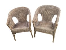 Pair of garden/conservatory wicker style arm chairs, some wear to wicker