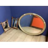 Oval bevelled glass wall mirror with wooden carved frame, some losses Overall W 109cmWx89cmH and a