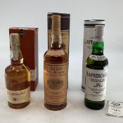 Three bottles of boxed single malt whisky. Glenmorangie 10 year 43% Vol 1Ltr. Laphroaig 10 year 70cl