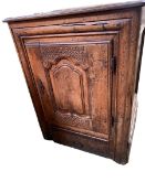 A rustic country style Continental oak single carved -door side cupboard, with drawer beneath , with