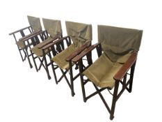 Set of four folding directors chairs, as found with some wear to fabric, and some cushions