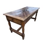 An Oak three plank top kitchen table, with stretcher to base, 151cm L, x 71cmW x78cmH