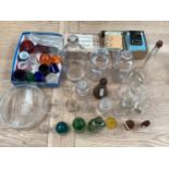 A collection of glassware mainly by Wood Bros Barnsley relating to chemistry and chemical storage.