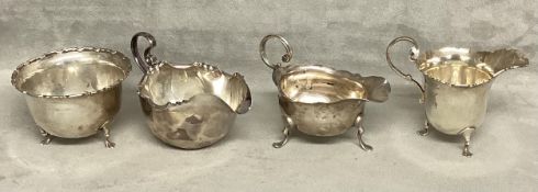 Three sterling silver cream jugs together with a sugar bowl. Various dates and makers. 210