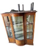 Mahogany tilt top breakfast table on quadruped reeded legs to castors and bow front glazed cabinet