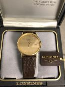 An unmarked yellow metal Gents Longines wristwatch.Quartz movement. Yellow metal 32mm case with gold