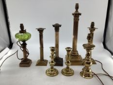 A pair of brass ejector candlesticks together with a selection of table lamps.