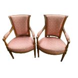 A pair of fruit wood framed arm chairs with pink upholstered seats and back and arm pads, some wear