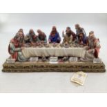 A Capodimonte figural group. The Last Supper by Germano Cortese on a gilt plinth 2007/1566. signed t