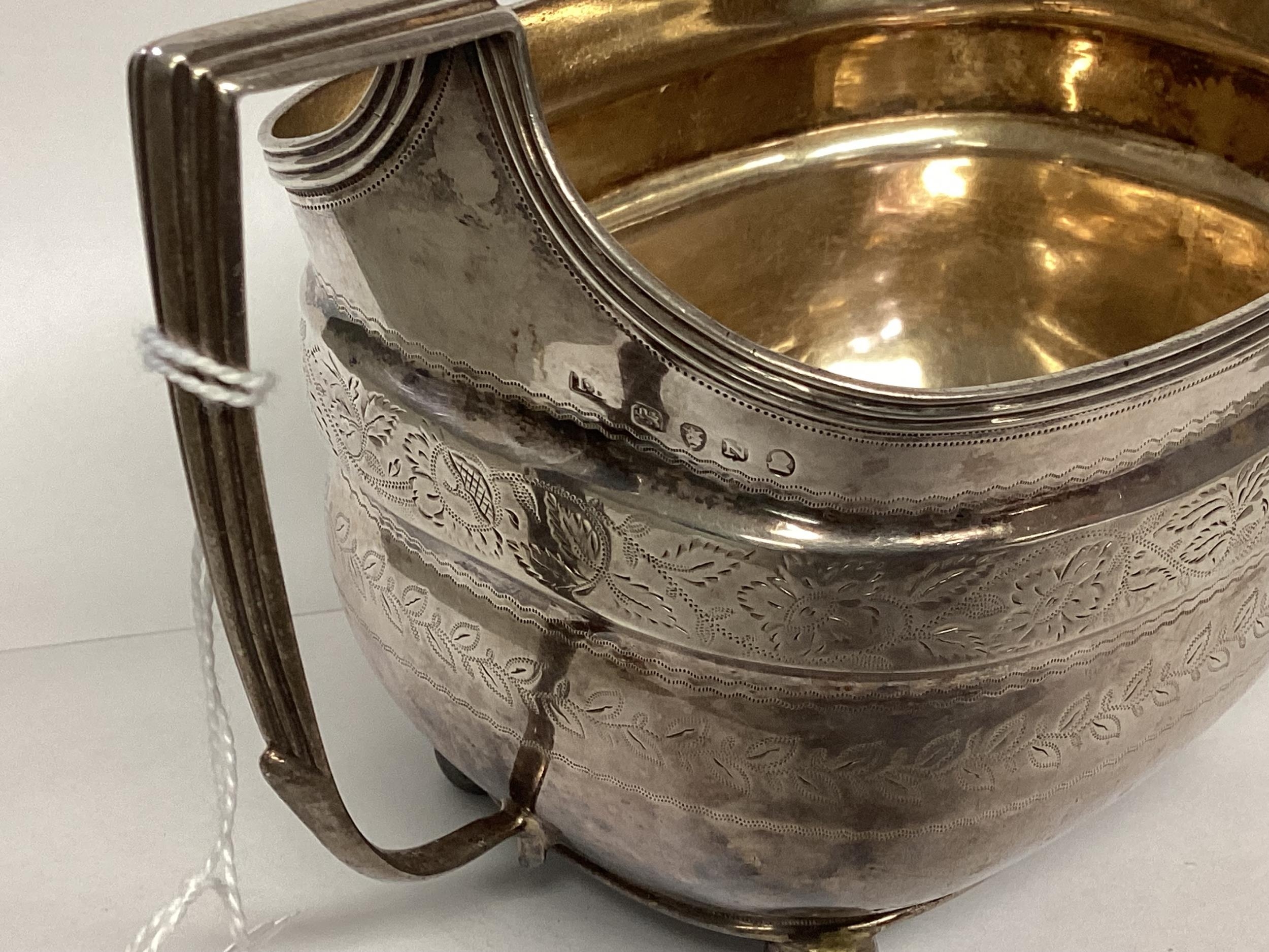 A Georgian sterling silver sugar bowl with chased decoration . 253g London 1808. - Image 3 of 3