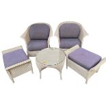 A five piece suite of furniture, to include two wicker arm chairs, circular glass top coffee