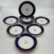 A Dore and Sevres set of twelve plates. Cobalt blue with gilt borders Printed marks to base. 24cm