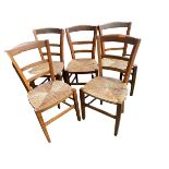 Set of 5 small elm country chairs with rush seats, some wear to cane work, and a black and gilt