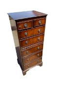 Modern reproduction narrow chest of 7 drawers and brushing slide, some wear and scratches