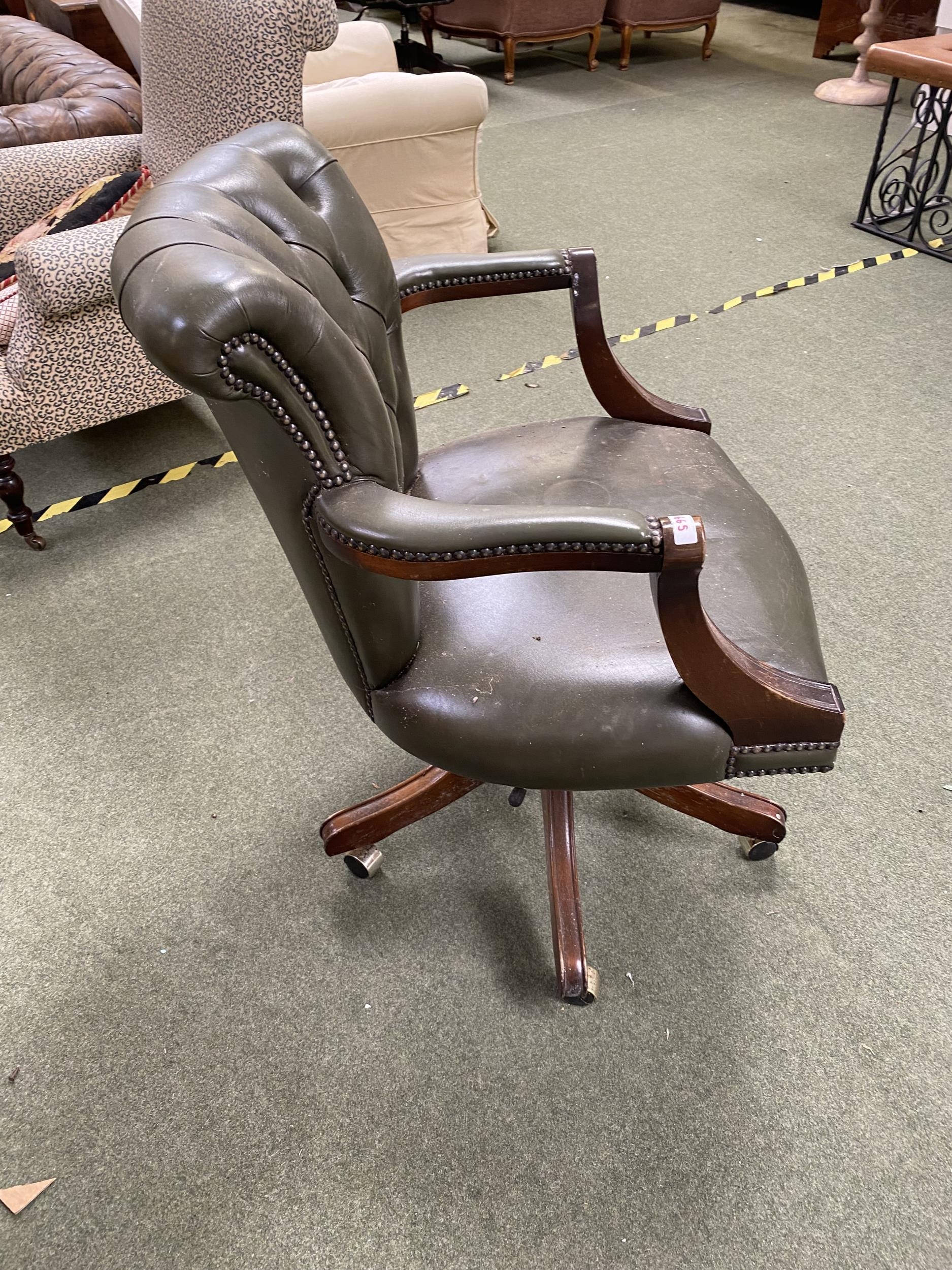 Green leather revolving chair, some wear and scuffs