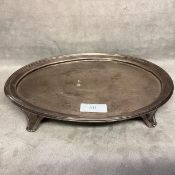 A Sterling silver oval card tray raised on four feet. London 1806. 398g.