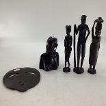 A collection of carved hardwood West African decorative items.