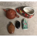 A collection of oriental style collectables to include snuff bottles.