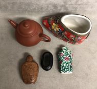 A collection of oriental style collectables to include snuff bottles.