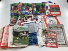 A collection of football programmes, Swindon, Tottenham together with enamel club badges WBA, Oxford