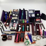 A large collection of high st and fashion watches. Most unworn, many in original boxes. To include