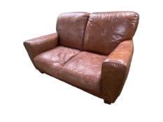 A good brown leather two seater sofa on square wooden feet, 50 x 89 x 92