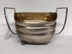 A Georgian sterling silver sugar bowl with chased decoration . 253g London 1808.