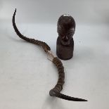 A set of African Gazelle antlers together with a hard wood West African bust of a man.