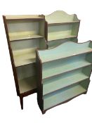 Three similar wooden waterfall bookcases, with painted interior, tallest is 136cmH x 62cmW, some