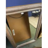 A silvered framed rectangular wall mirror