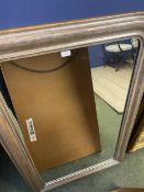 A silvered framed rectangular wall mirror