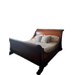 A large sleigh bed - see photos from it assembled in the house. Overall width 215cm. From a good