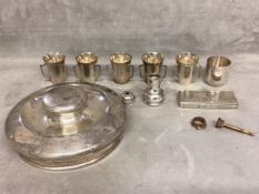 A collection of miscellaneous sterling silver items to include an ice bucket lid, 5 shot beakers