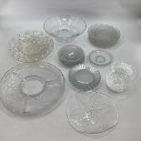 A collection of glassware to include an opalescent bowl and frosted plates in the manner of Lalique.