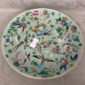 A C19th Chinese Celadon Porcelain plate decorated in Polychrome enamels, birds, butterflies, and