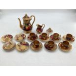 A Royal Worcester part Coffee Service, painted fruits and fauna, to include milk jug, Coffee Pot,