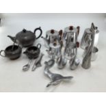 A stainless steel Picquot ware tea set together with stainless steel ornaments and a pewter tea pot