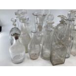 A collection of 19th/20th century glassware to include decanters , jugs vases etc.