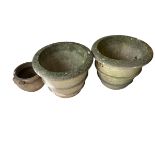 Two large weathered stone style garden planters and another smaller garden pot