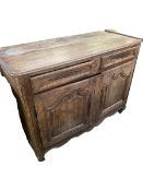 A C19th French oak rustic sideboard, with 2 short drawers over two cupboard doors, with much wear