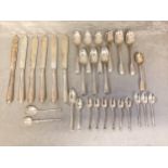 A collection of sterling silver cutlery, tea spoons silver bladed fish knives etc. Gross. Approx