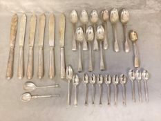 A collection of sterling silver cutlery, tea spoons silver bladed fish knives etc. Gross. Approx