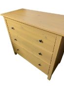 An Ikea chest of 3 long drawers, yellow/honey coloured. Some sagging to drawer bases, functional but