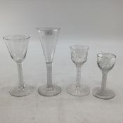 A group of four 18th century, circa 1770 opaque twist wine glasses, two with etched bowls.