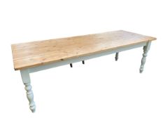 A kitchen table, with pine top and cream painted base, 244cm Long, and 91cm wide, and overall height