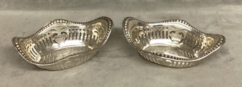 A pair of sterling silver pierced dishes of oval form. Charles S Green and Co, Birmingham. 1910.