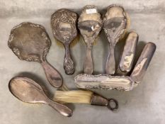 A collection of sterling silver dressing table items brushes, mirror, various dates and makers.