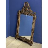 Rectangular hanging wall mirror with ornate carved gilt frame overall: 100cmHx56cmW